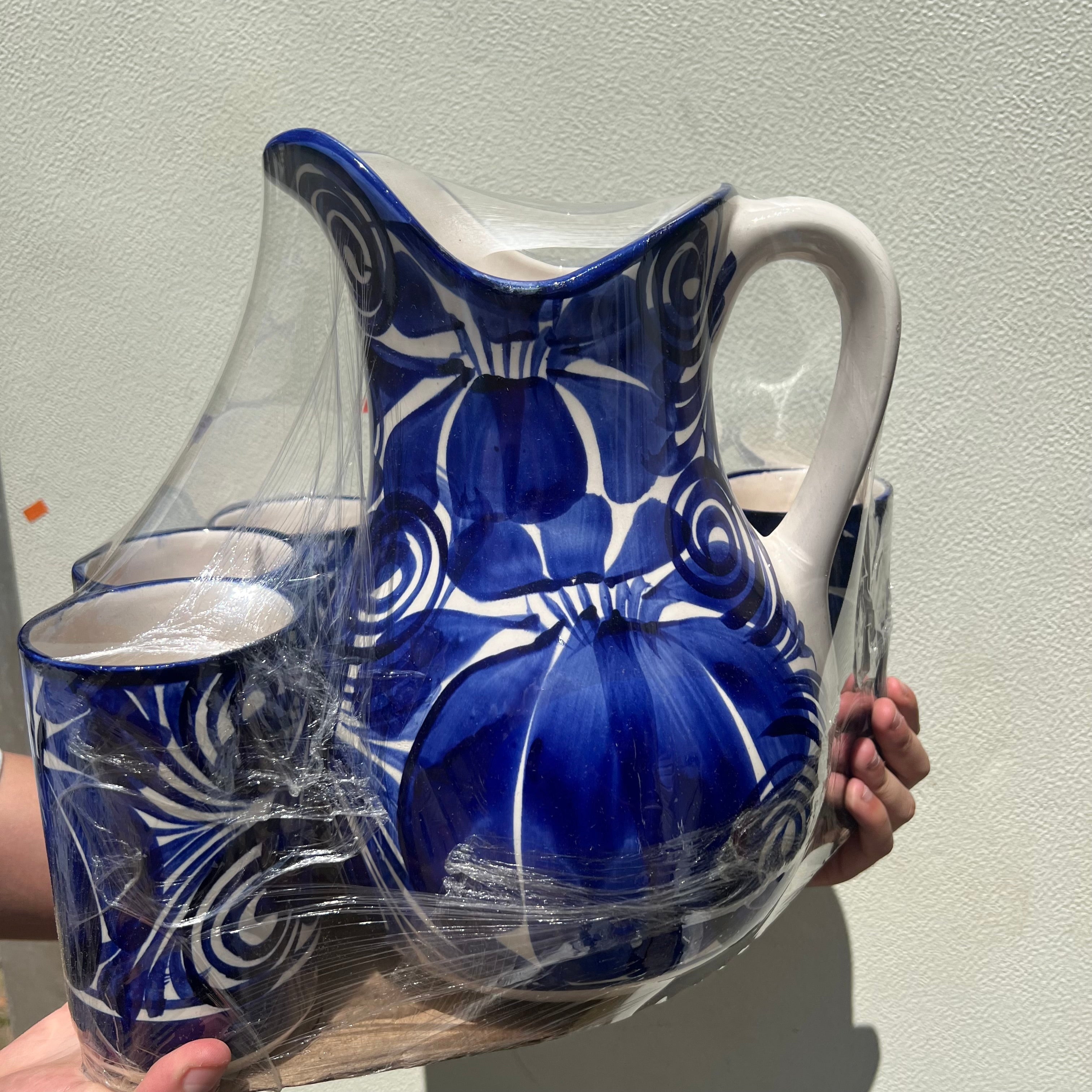 Juego de jarra y tazas de cerámica azul